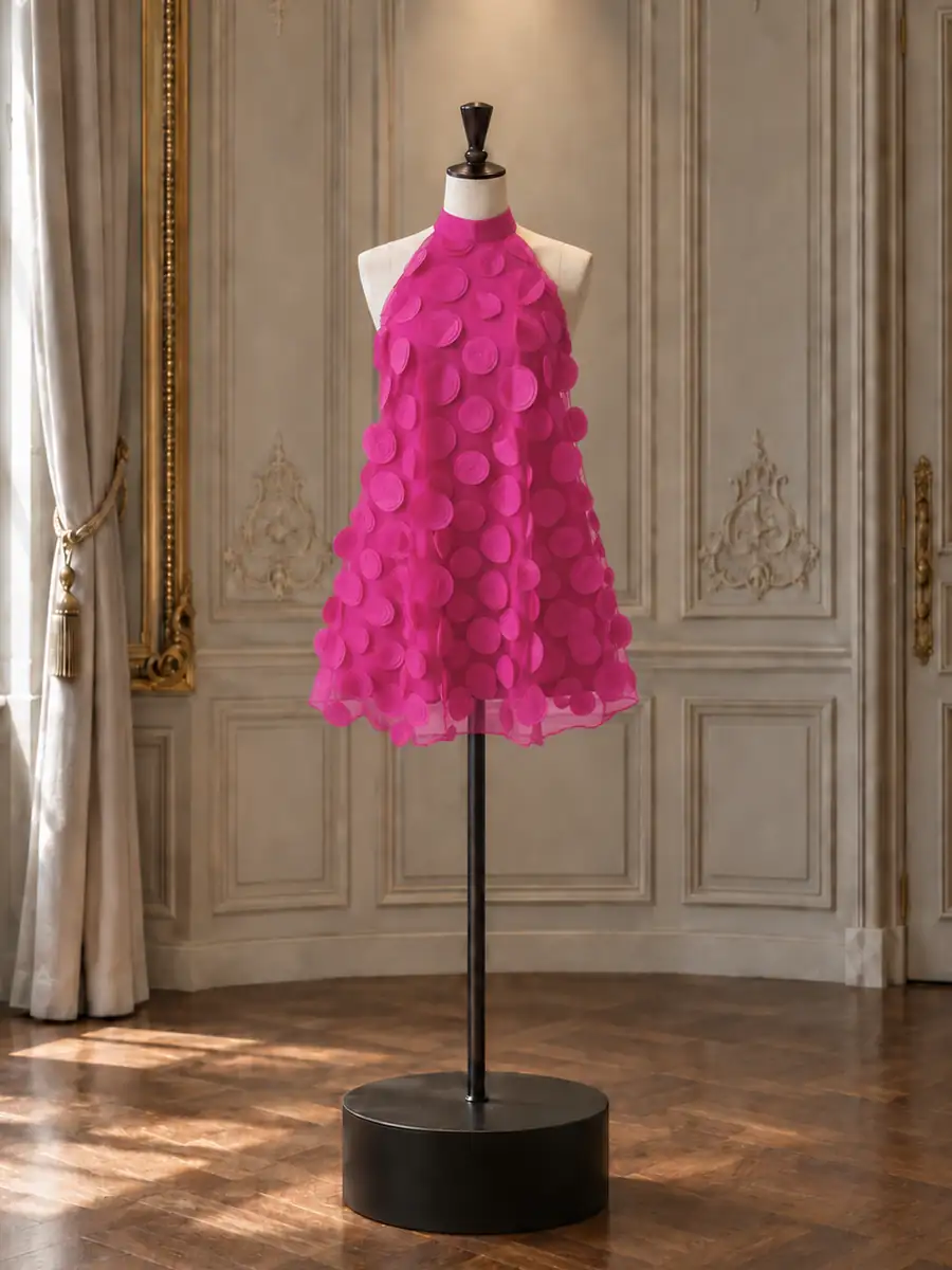 Fuchsia organza halter A-line with petal appliqué, on a mannequin