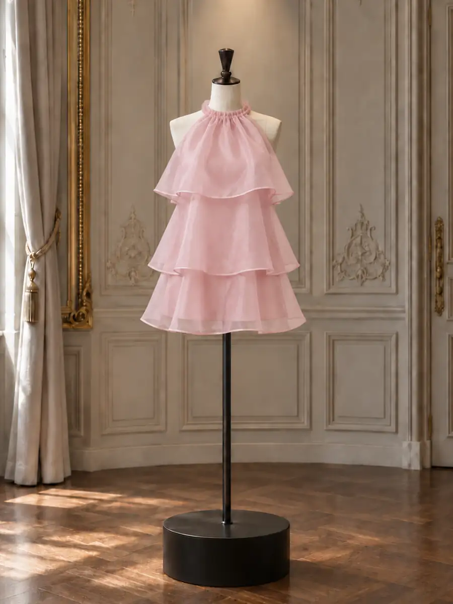 Blush organza three-tier halter mini, on a mannequin